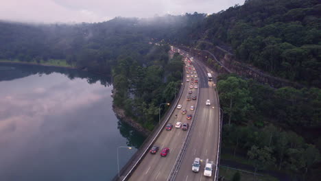 Following-bridge-traffic-during-rush-hour-over-the-middle-harbour,-Sydney