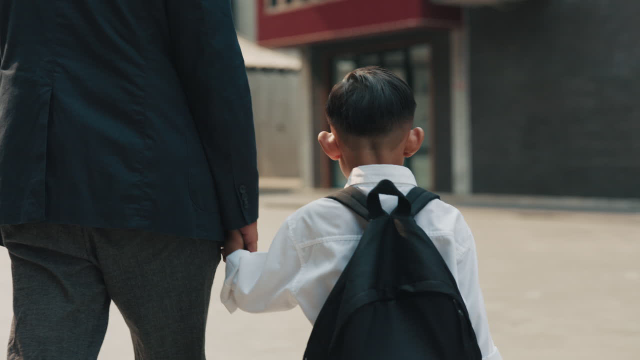 Father and Son Walking to School