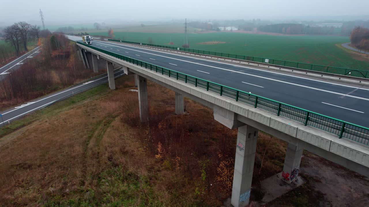Empty bridge.nCity lockdown empty roads due coronavirus. Old town tower view no cars drone shot. Bridge shot during sunrise aerial view.