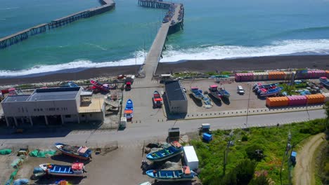 port-or-caleta-meguellines,-constitucion-chile-drone-shot-sunny-day-with-fishing-boats-drone-reveal-shot