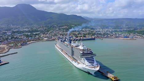 massive luxury cruise liner docked in puerto plata port, taino bay