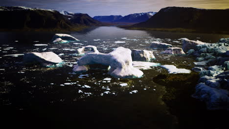 glistening icebergs float serenely in a tranquil arctic landscape during sunset