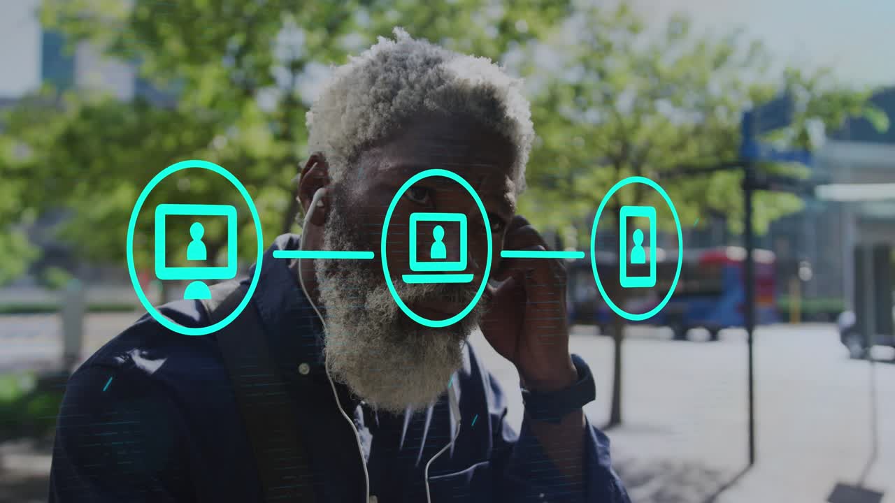 Animation af applikationsikoner og flydende prikker over en ældre afroamerikansk mand med hovedtelefoner på.