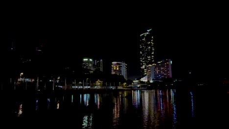 city lights reflecting on a calm canal