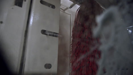 foam sprays against vehicle window in car wash, interior view