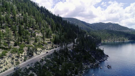 road with cars by lake tahoe