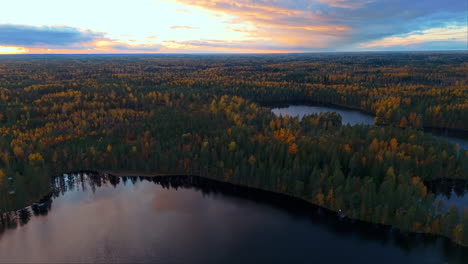 sun has just set over fiskträsk lake in sipoonkorpi national park, finland