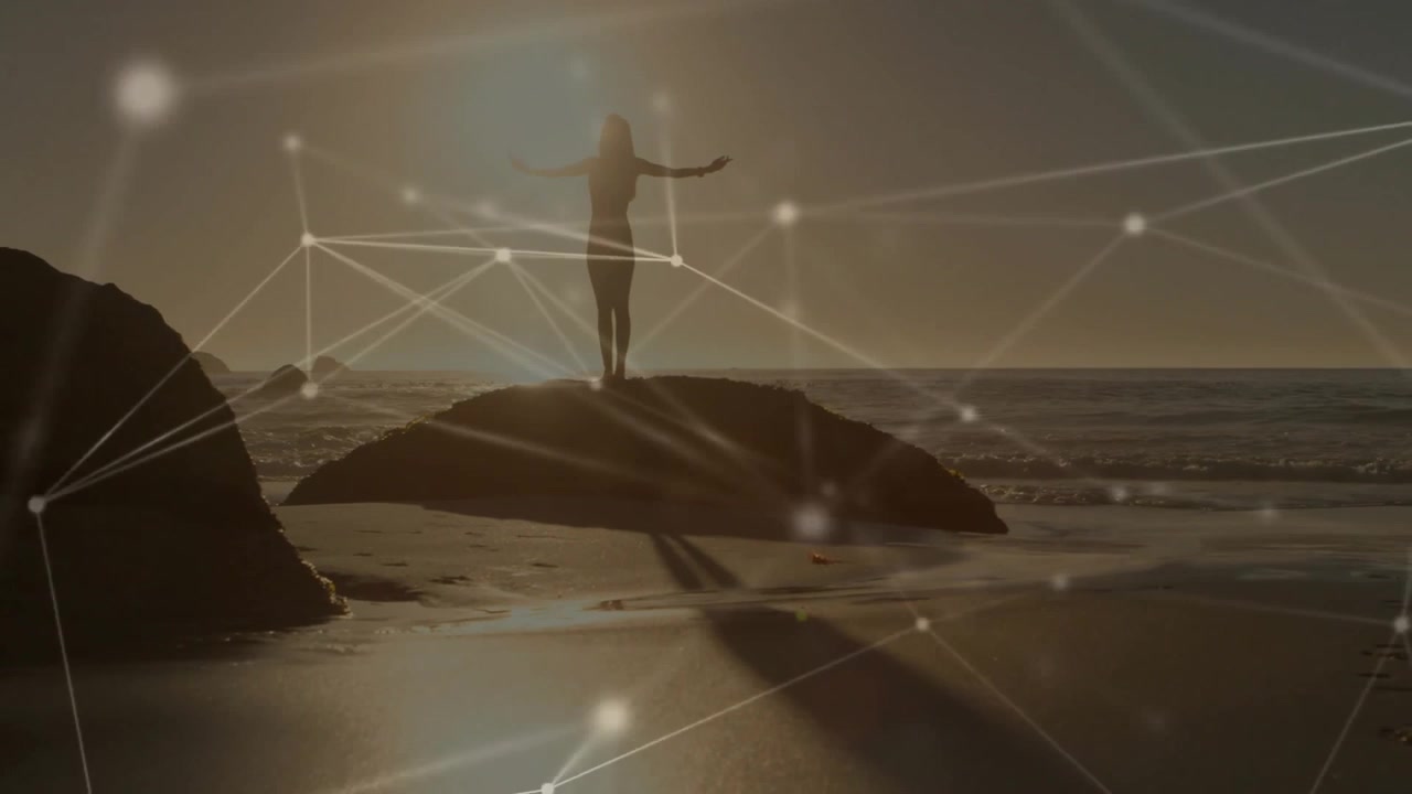 Sun dipping horizon initiating technology overlay around woman on shore rock shifting arms outward
