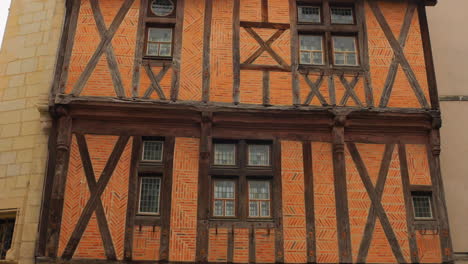 half-timber framed historic house with rustic colors of brown and orange exteriors