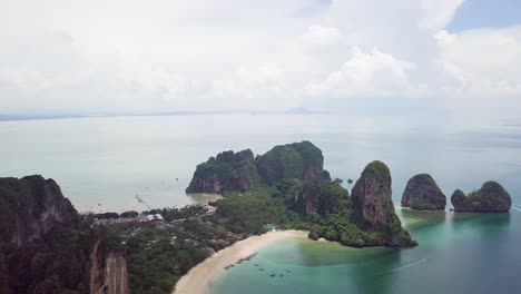 Panning-from-left-to-right-of-an-aerial-drone-shot-of-the-the-beaches-and-crags-in-Krabi,-facing-Phang-Nga-Bay-in-Andaman-Sea-in-the-south-of-Thailand