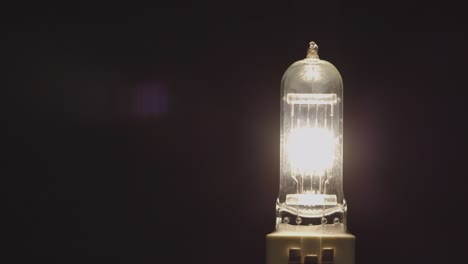 switching on a light bulb for a professional film lamp