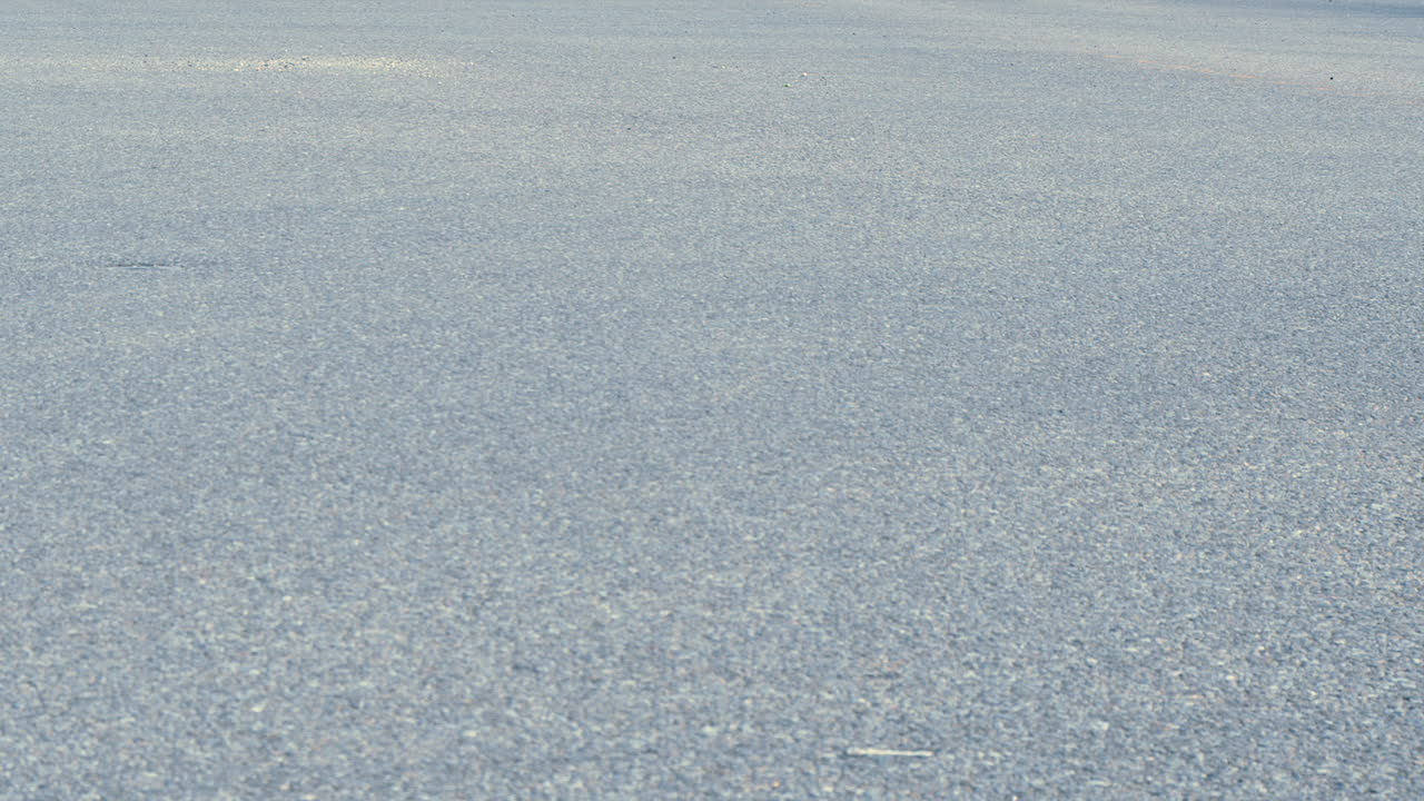 Paved street infrastructure copy space background, traffic driving by