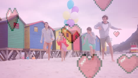 animation of heart icons over happy caucasian family running at beach