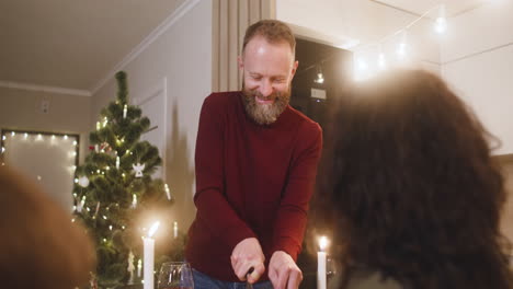 family sitting at christmas dinner table 2