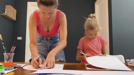 mother and daughter creating art together