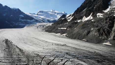 Aerial-flyover-over-the-crevasses-of-the-Corbassiere-glacier-in-Valais,-Switzerland