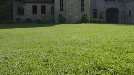 shot-across-the-grounds-to-reveal-a-beautiful-stone-castle