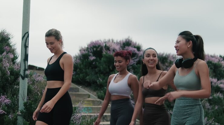 Four Friends Enjoying a Post-Workout Walk and Talk