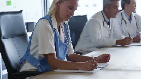 Concentrated-doctors-at-a-meeting