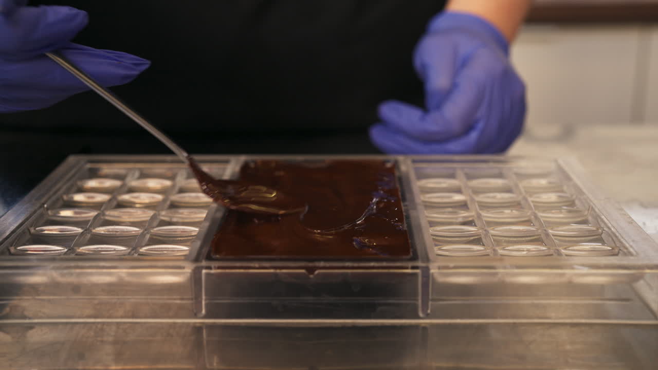 Close up shot of man's hands cooking chocolate, interior