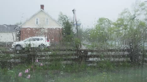 spring rain running down window