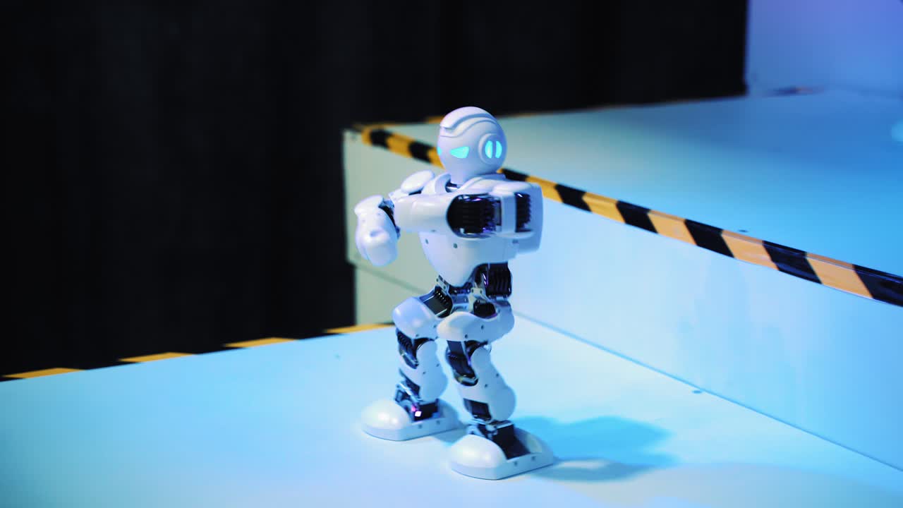 Dancing humanoid robot on the exhibition. Toy robots. Science Festival