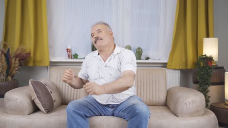 happy old man dancing to the camera.