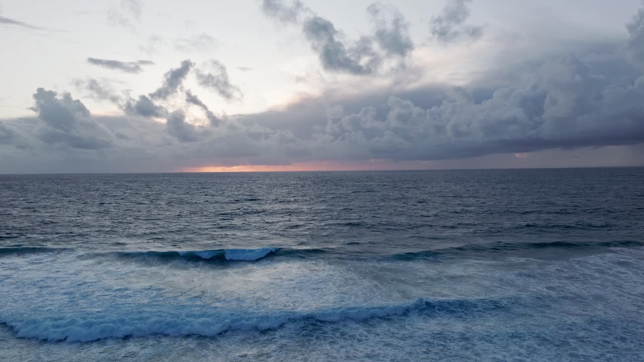 Dramatic Ocean Sunset with Cloudy Sky