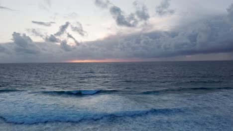 dramatic ocean sunset with cloudy sky