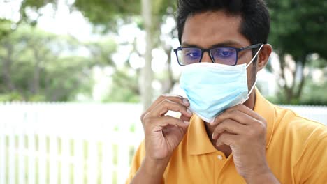 sick men with a face mask outdoor