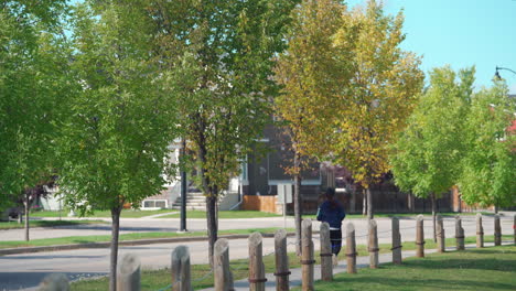 person running through calm neighbourhood in the middle of the day