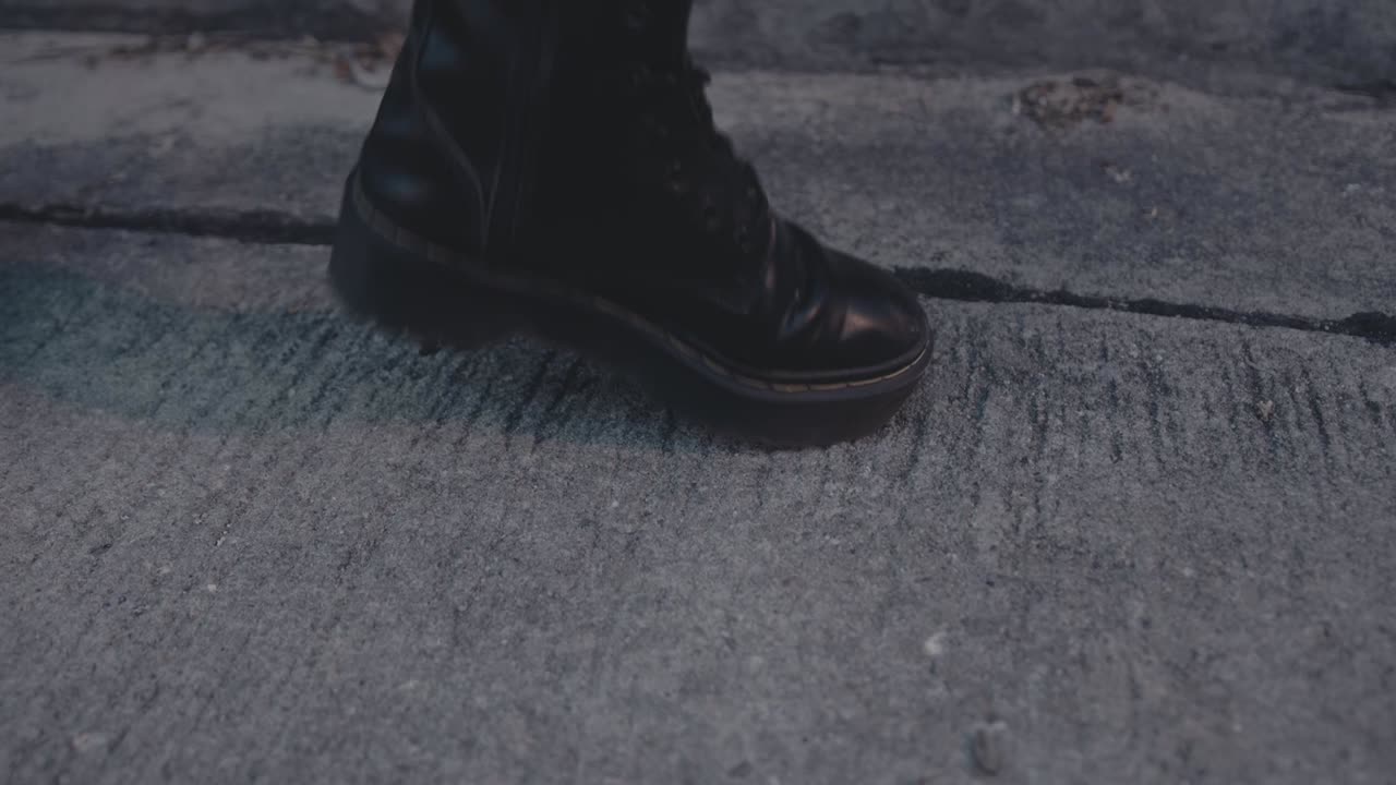 Black Platform Boots on Concrete
