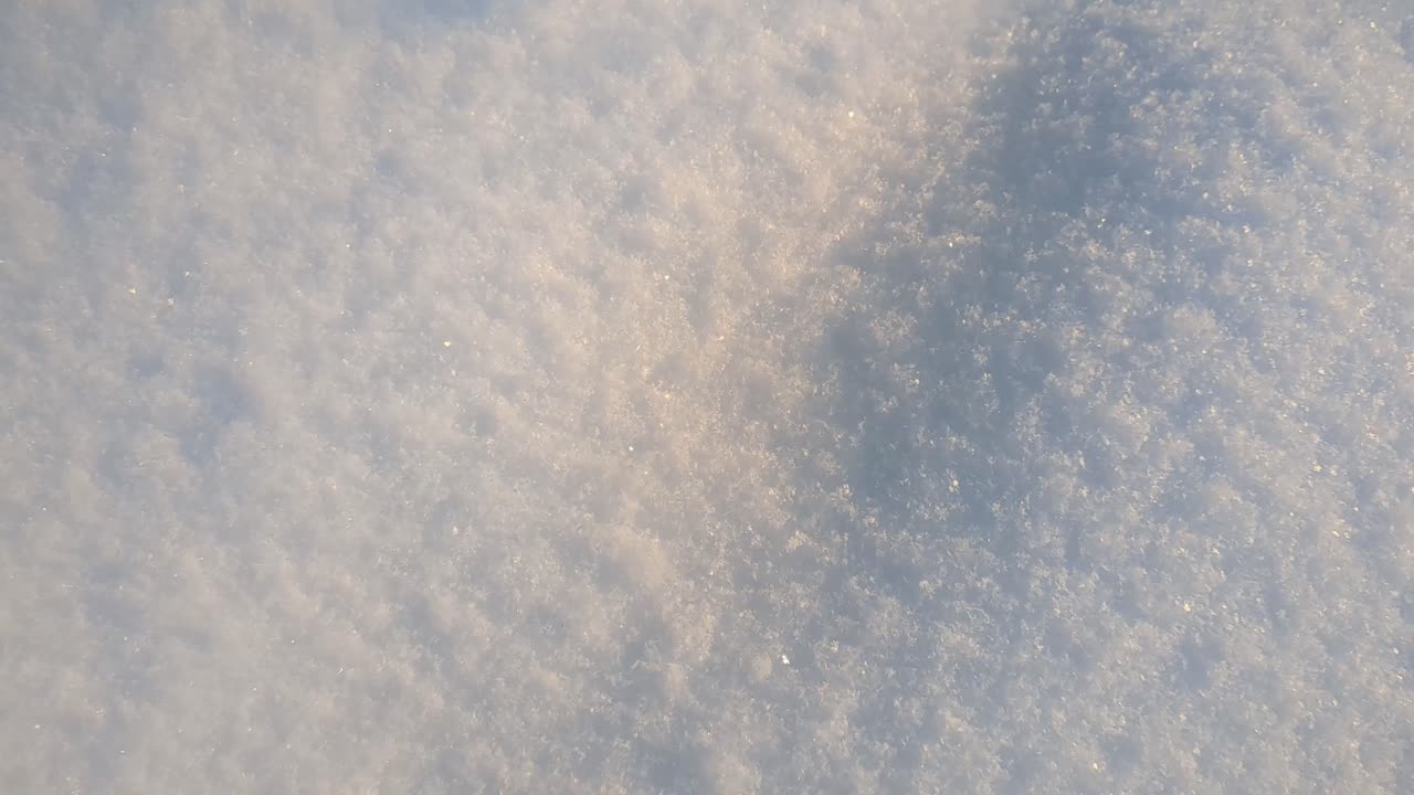 Pristine fresh white snow surface in winter, winter detail, close up