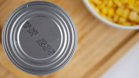 close-up of canned corn and bowl of corn kernels