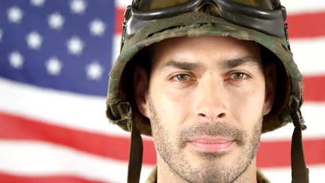 Soldier-standing-in-front-of-American-flag