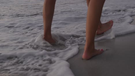 young adult couple relaxing at the seaside