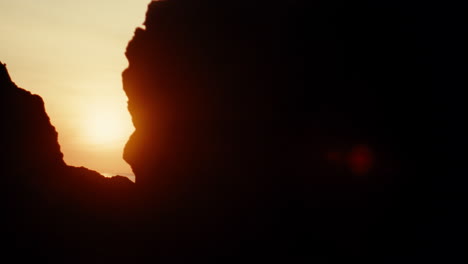 sunrise through rocks