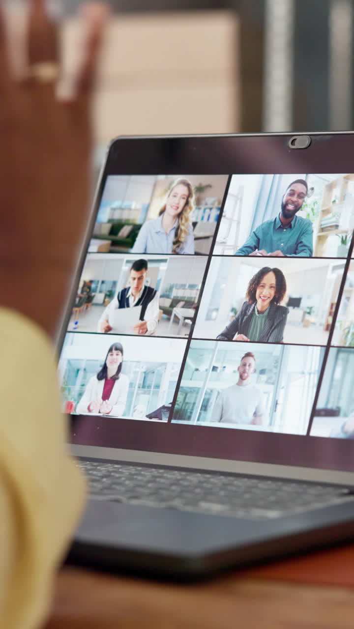 Person Waving During a Virtual Business Video Conference on Laptop