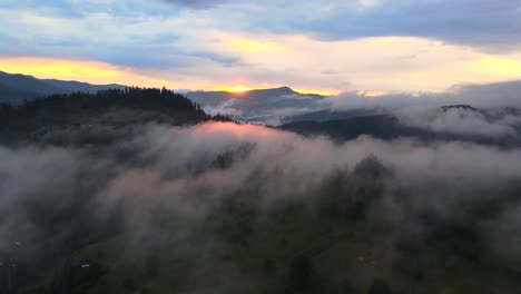 Mist-covering-and-surrounding-hilltops-on-a-early-morning-during-sunrise-in-wild-landscape