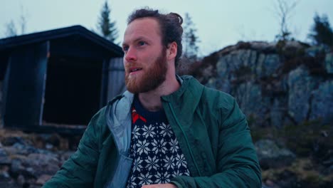 close up of man paddling boat on the lake in norway