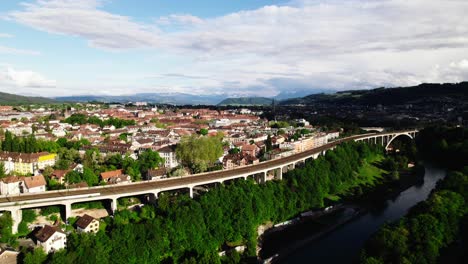 Bern,-Switzerland-skyline-with-Alps-in-distance,-4K-aerial-view