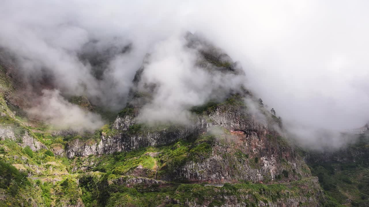 Scenic mountain pass with mysterious fog at Curral das Freiras, Madeira. Aerial