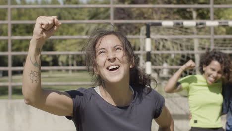 Front-View-Of-Happy-Female-Football-Player-Rejoicing-Victory