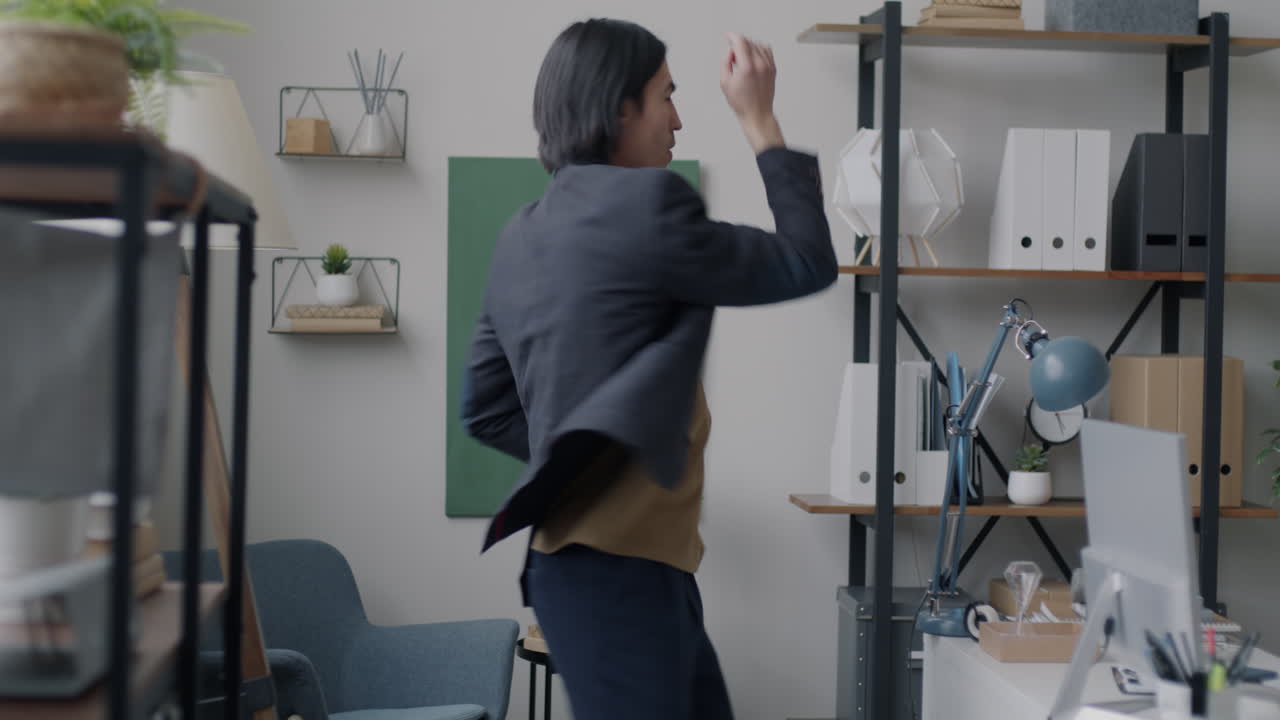 Man Dancing in Office
