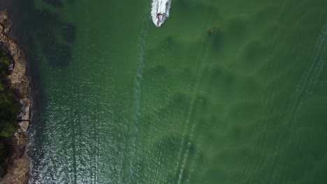 birds eye pov over river and boats