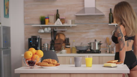 lady in lingerie preparing breakfast