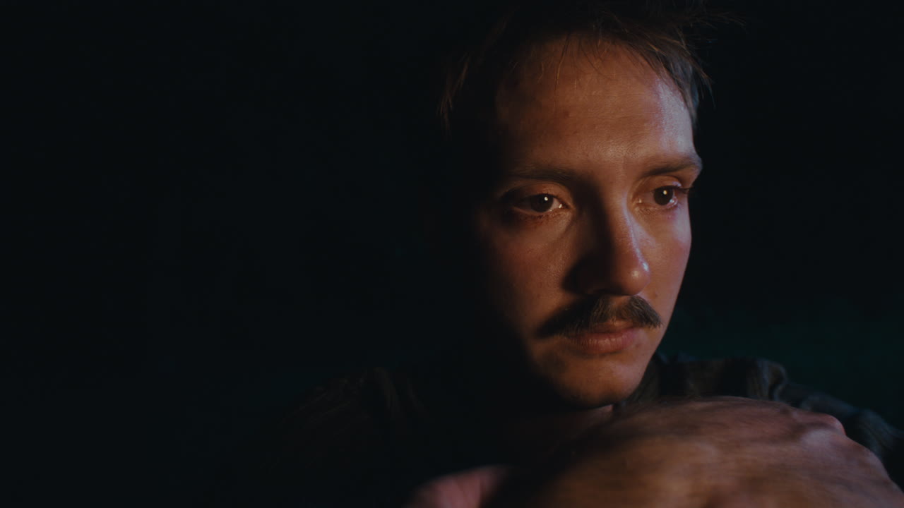 Man with Mustache in Low Light