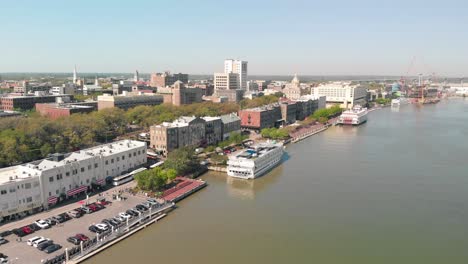 aerial view of historic savannah water front with parked cars and buildings lined up