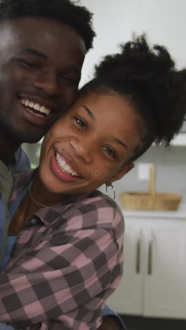 video of happy african american couple embracing at home