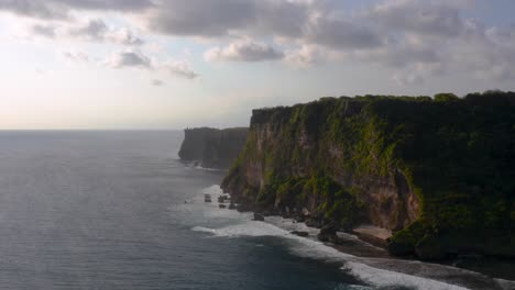 silhouette of majestic uluwatu cliffs standing tall beside